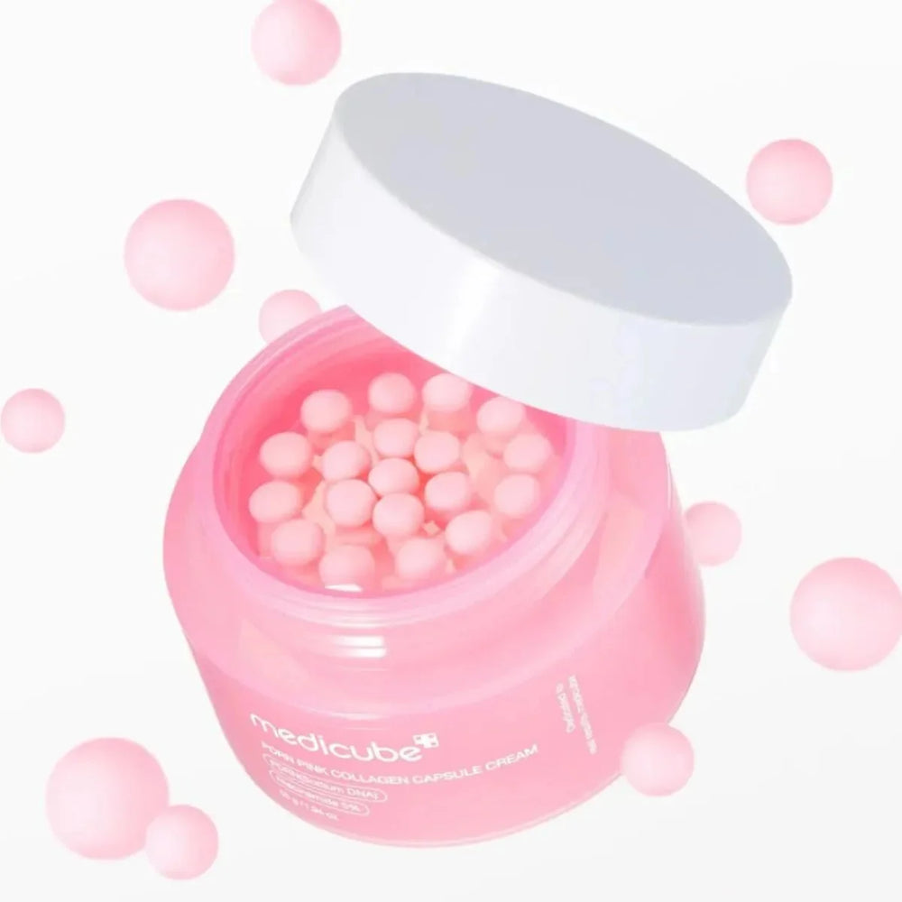 Pink jar of Medicube capsules with a white lid on a light pink background