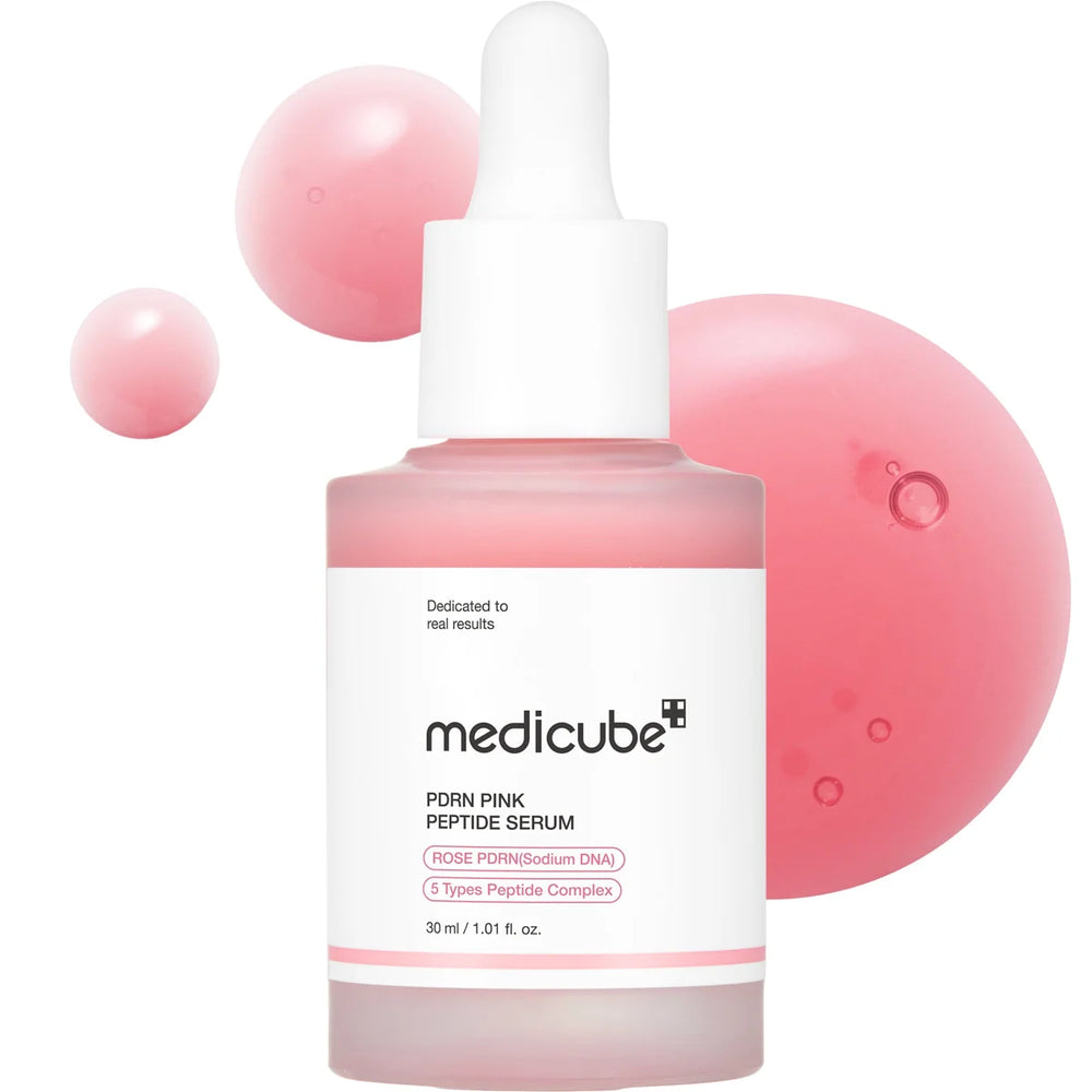 Medicube Pink Peptide Serum bottle with dropper on a white background