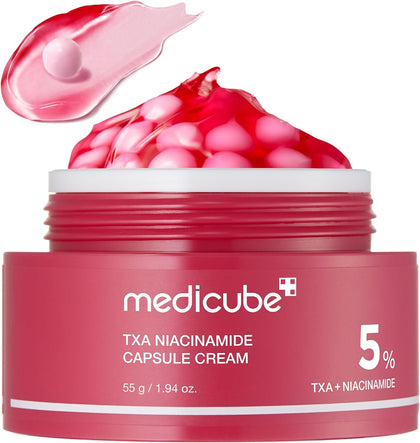 Red jar of Medicube TXA Niacinamide Capsule Cream with pink cream and capsules on a white background