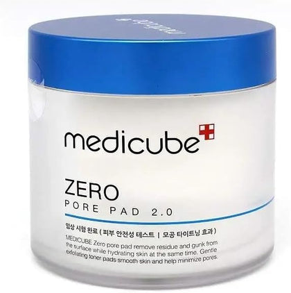 A white cosmetic jar of medicube Zero Pore Pad 2.0 with a blue lid, shown on a plain white background.