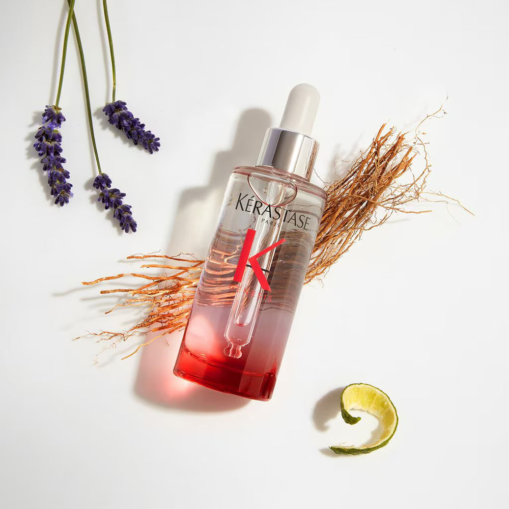 Kerastase bottle with lavender and wheat on a white background