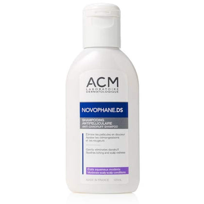 A white plastic bottle of ACM Laboratoire Dermatologue Novophane.DS shampoo with a white flip-top cap, set against a plain white background.