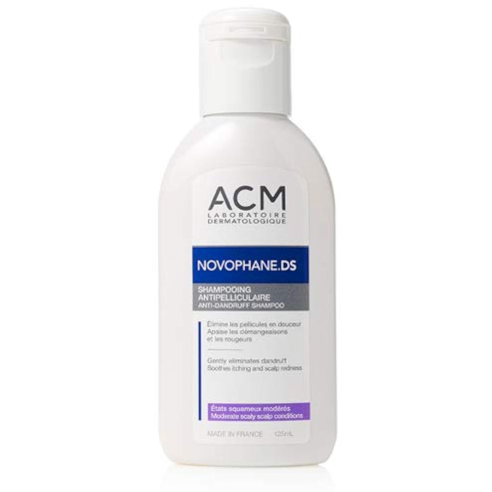 A white plastic bottle of ACM Laboratoire Dermatologue Novophane.DS shampoo with a white flip-top cap, set against a plain white background.