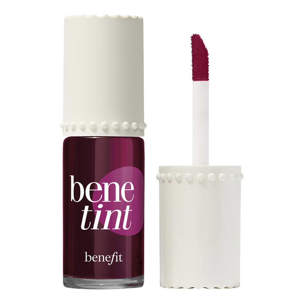 Benefit Bentine nail polish in a deep berry purple shade, shown with its white cap off and the applicator wand displayed next to it on a clean white background.