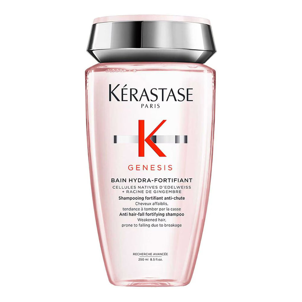 Kérastase Paris Genesis Bain Hydra-Fortifiant shampoo bottle in a translucent pink bottle with a metallic silver cap, on a white background.