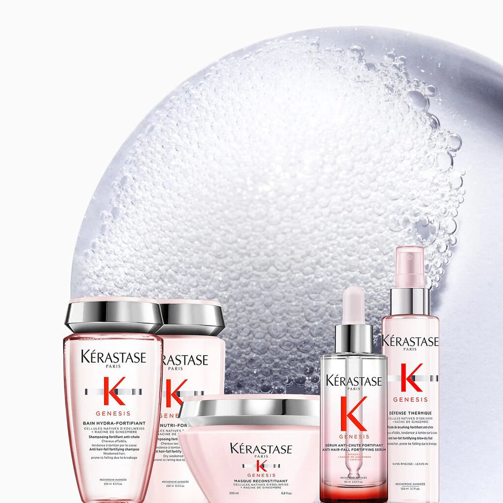 Kérastase hair care products with a decorative bubble background