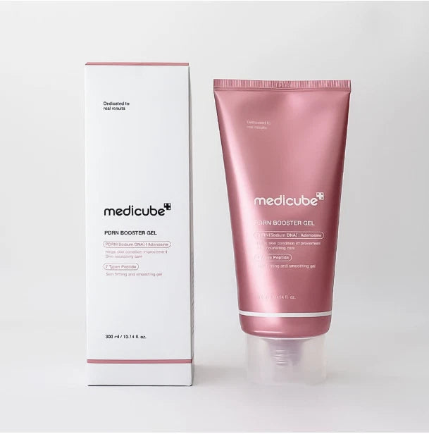 Medicube Skin Booster Gel shown in a metallic rose pink squeeze tube next to its white and pink product box on a light gray background.