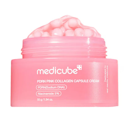 A pink cosmetic jar of medicube PDRN Pink Collagen Capsule Cream with the cream visible inside, on a solid white background.