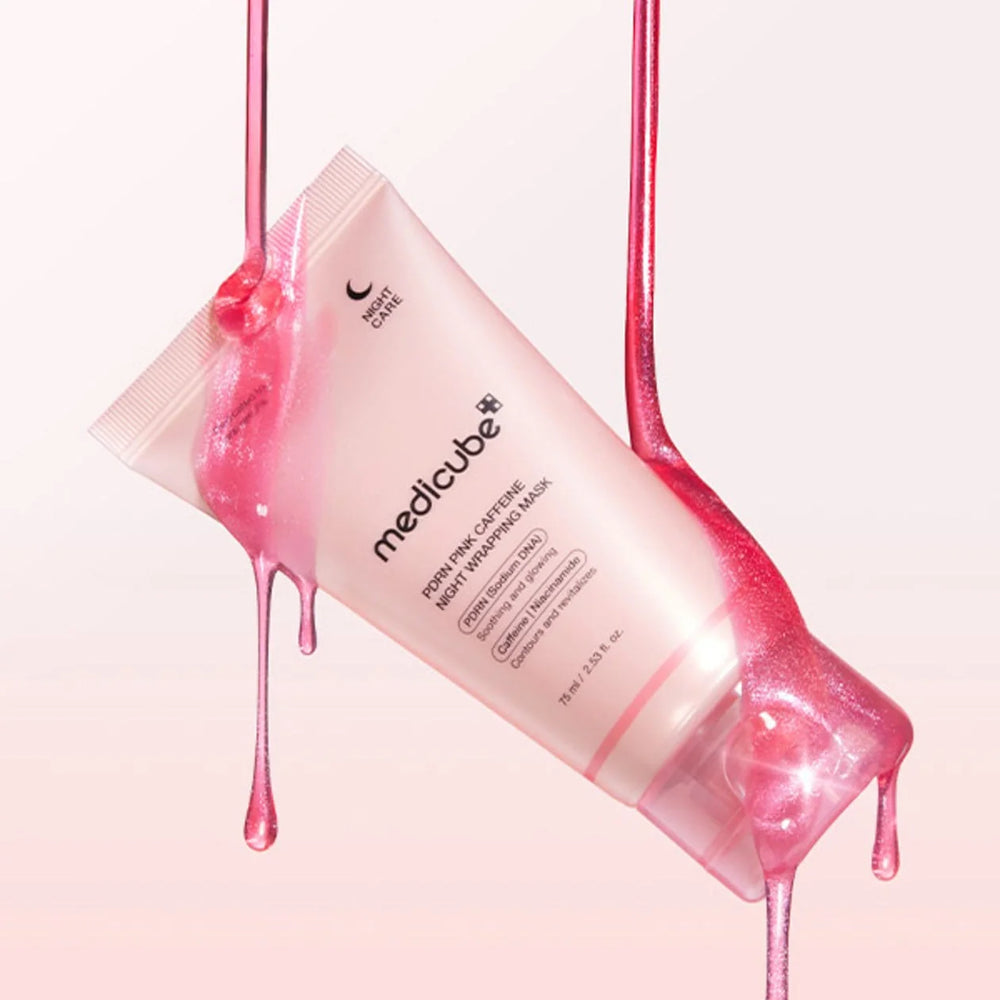 Pink medicube product with pink liquid dripping from it on a light pink background