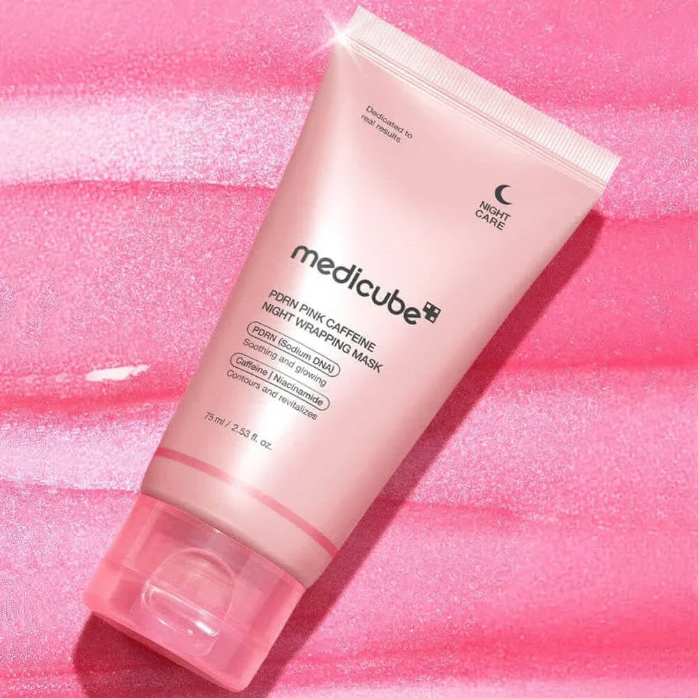 Medicube night care mask tube on a pink textured background Medicube PDRN Pink Caffeine Night Wrapping Mask 75ml