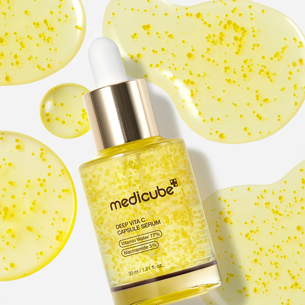 Medicube Deep Vita C Capsule Serum with yellow gel pads on a white background