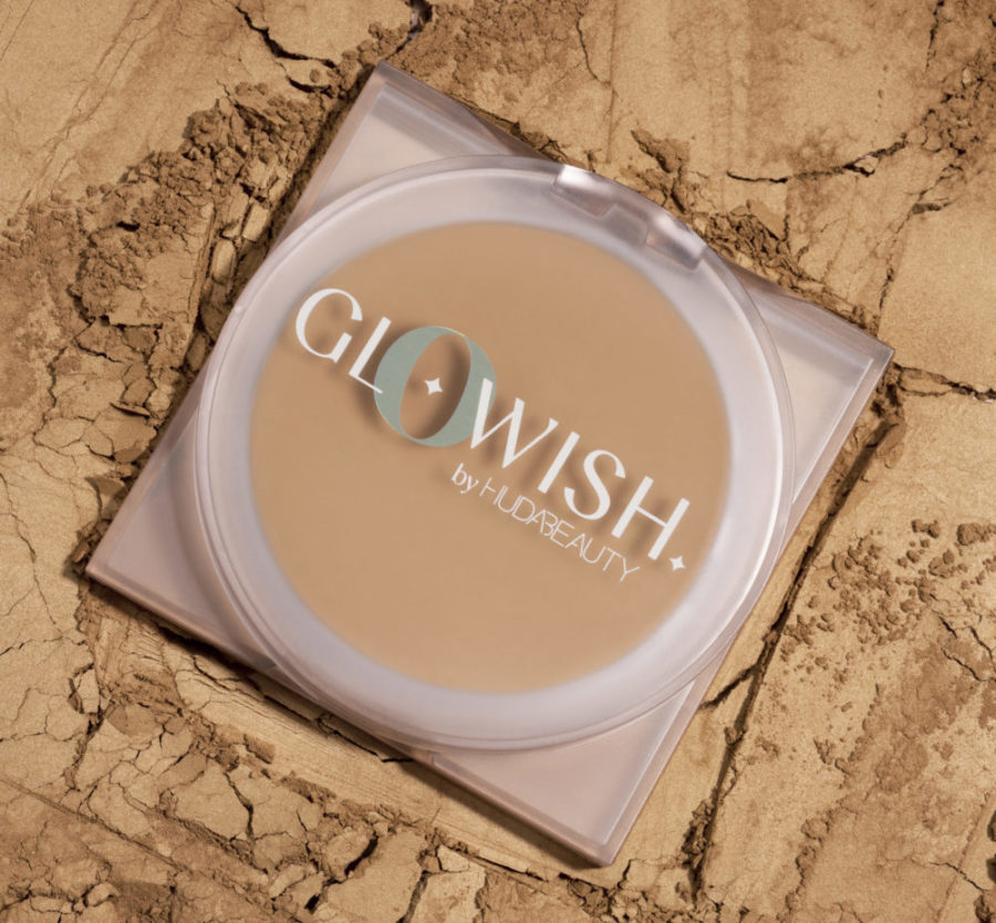 GloWish by Huda Beauty Luminous Pressed Powder Foundation circular compact open in Shade 03 Light.